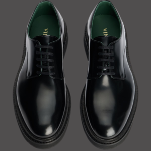 Polished black leather derby shoes.